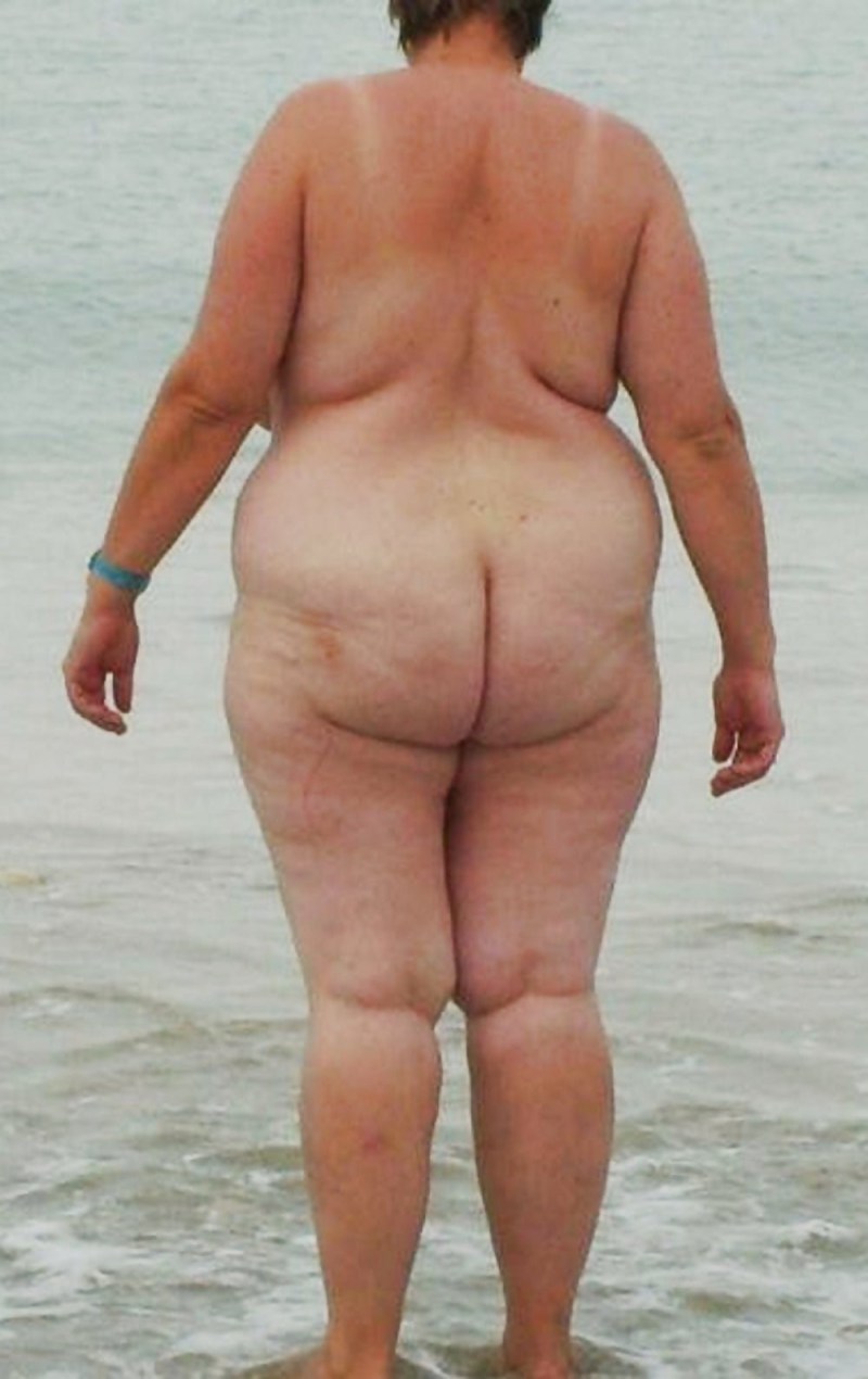 Naked ass old woman on the beach