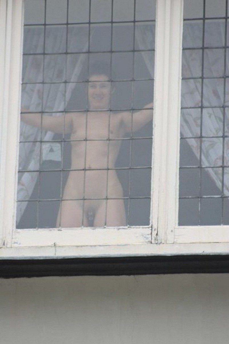 Naked woman through the window
