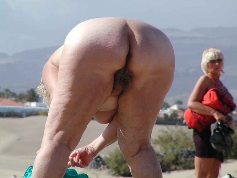 Elderly women on the beach without panties
