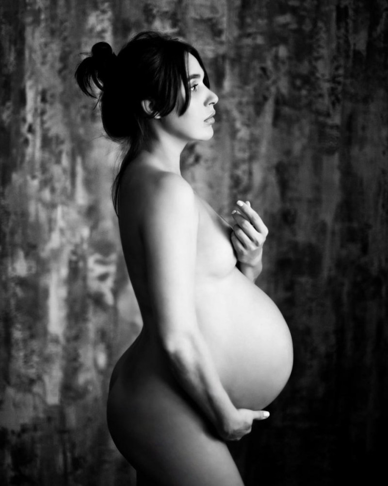 Erotic photo shoot of a pregnant woman