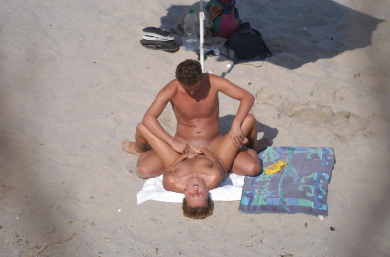 Drunk naked men on the beach