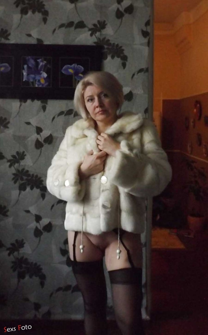 Naked in a fur coat and stockings private