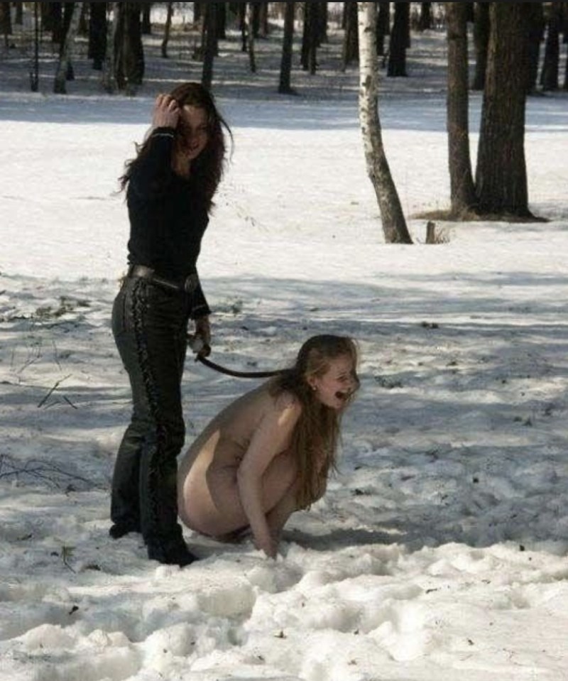 Naked slave on a leash on the street