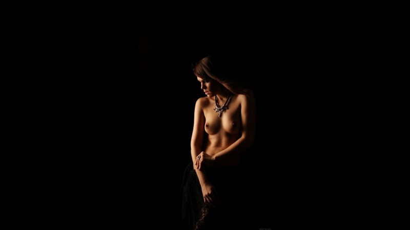 Naked women on a dark background