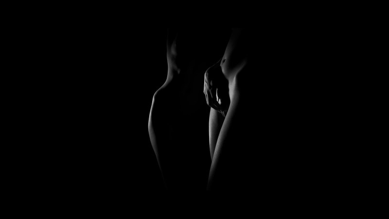 Erotic wallpaper on a dark background
