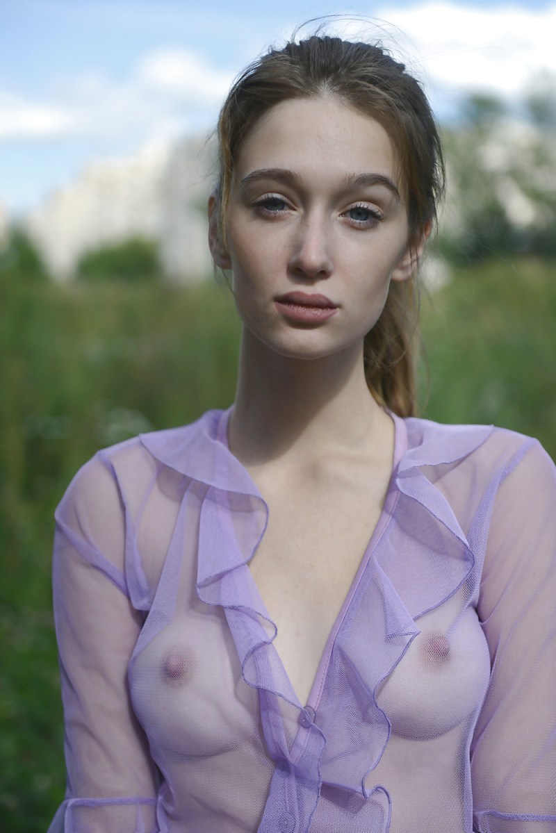 Girl in a transparent blouse nude