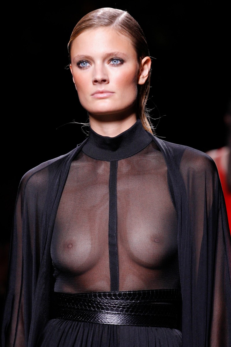 Naked in a transparent blouse