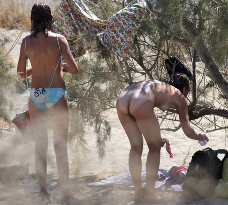 Girls change clothes on the beach