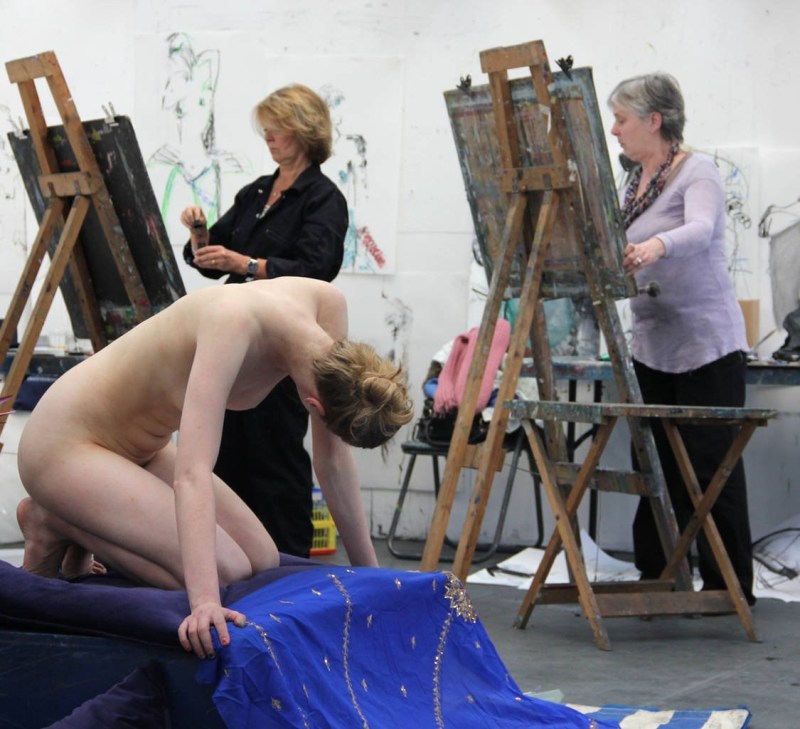 Naked model and artist