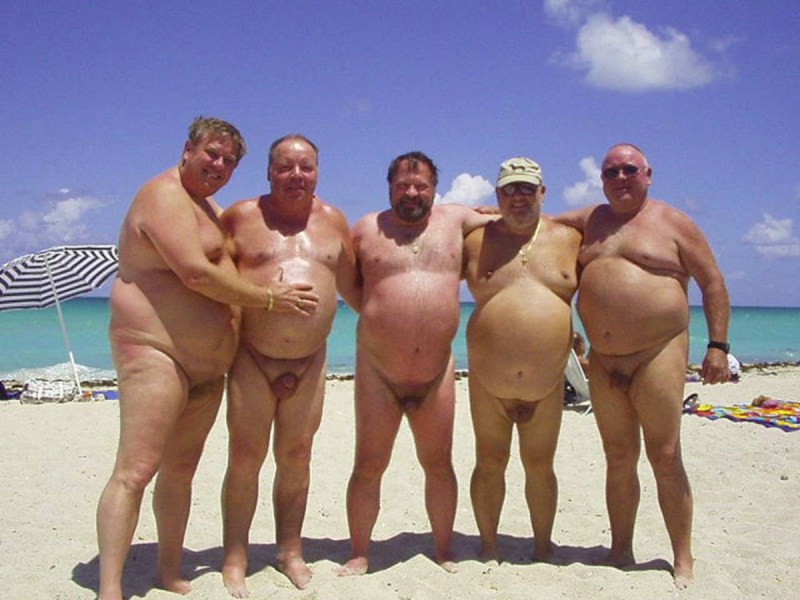 Naked fat man on the beach