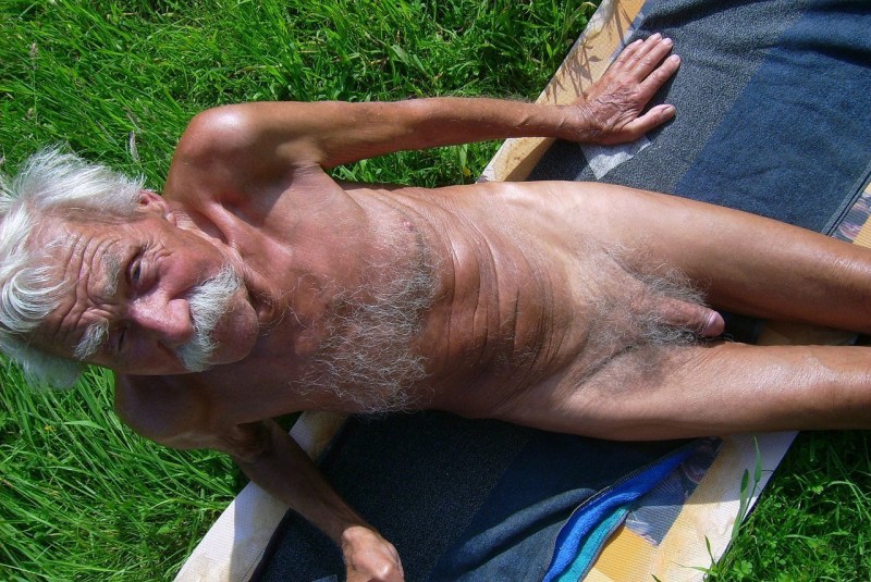 Naked grandfather at the computer