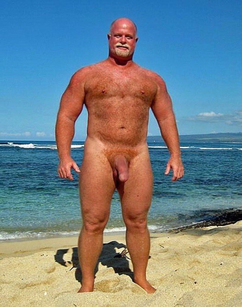 A guy with a huge member on the beach