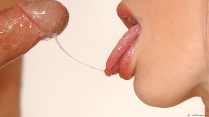 The girl kisses the head of the penis