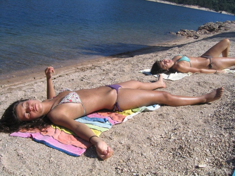 The girl sunbathes in a private swimsuit