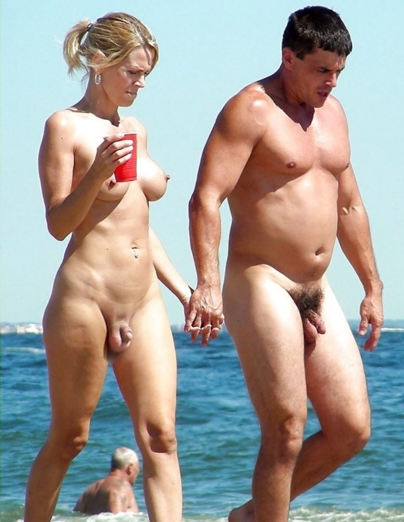 Naked pairs with an erection on the beach