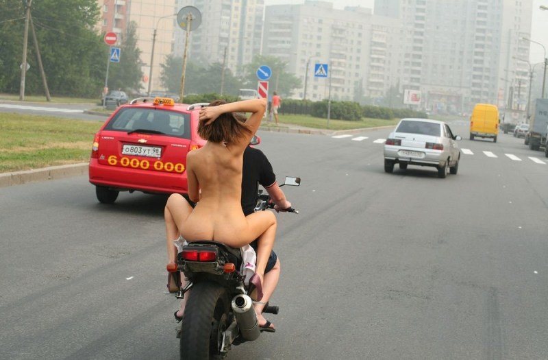 Rolled naked on a motorcycle