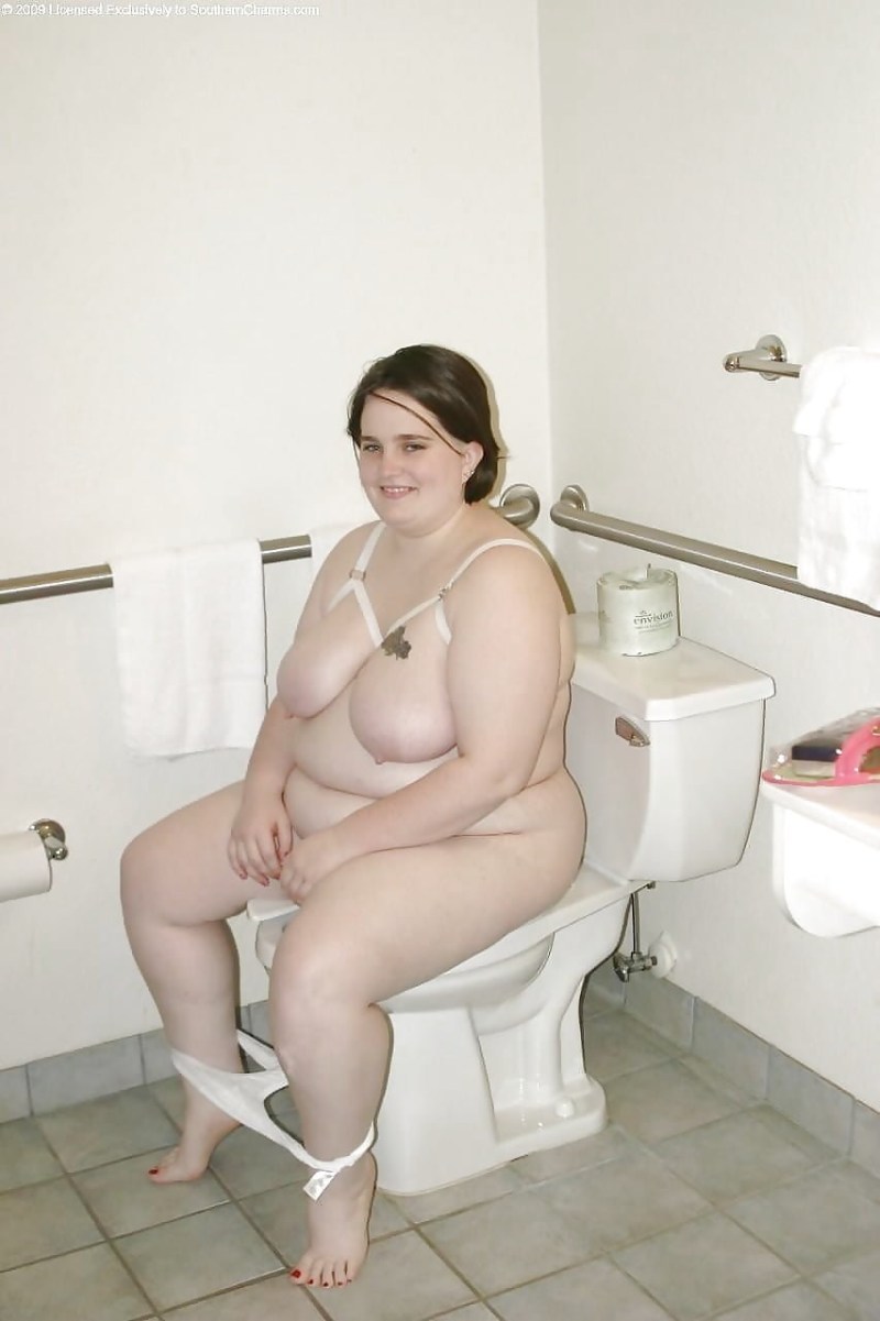 Naked fat woman on the toilet